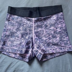 Under Armor purple and blue pattern spandex. Size small. Heat gear. Black band